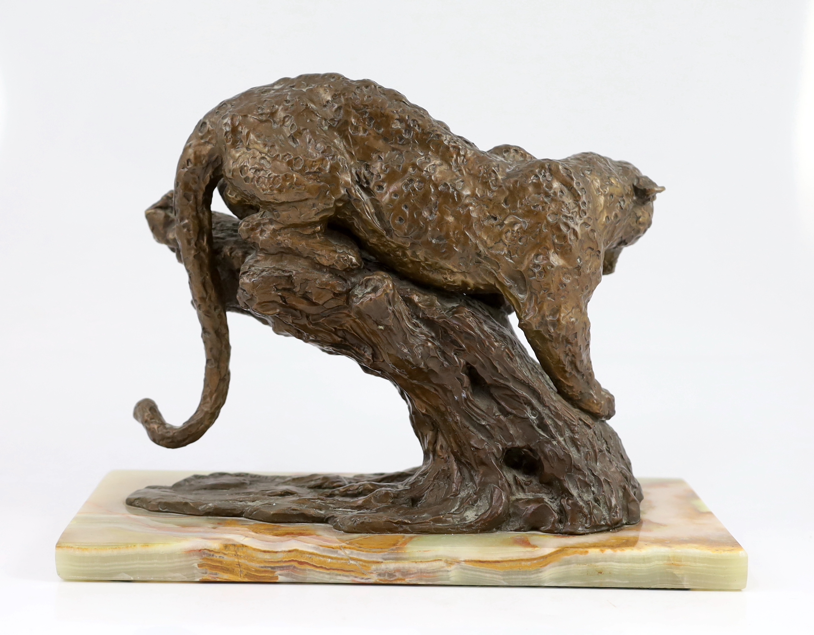 William Timym (British, 1902-1990). A bronze model of a jaguar crouched upon a tree trunk, signed in the bronze with Morris Singer foundry stamp, on green onyx plinth, 34.5cm long, deep 16cm, 25cm high